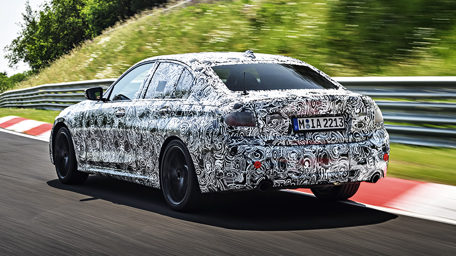 BMW 3 Series in action. Disguised prototype of the BMW 3 cornering on the racetrack.