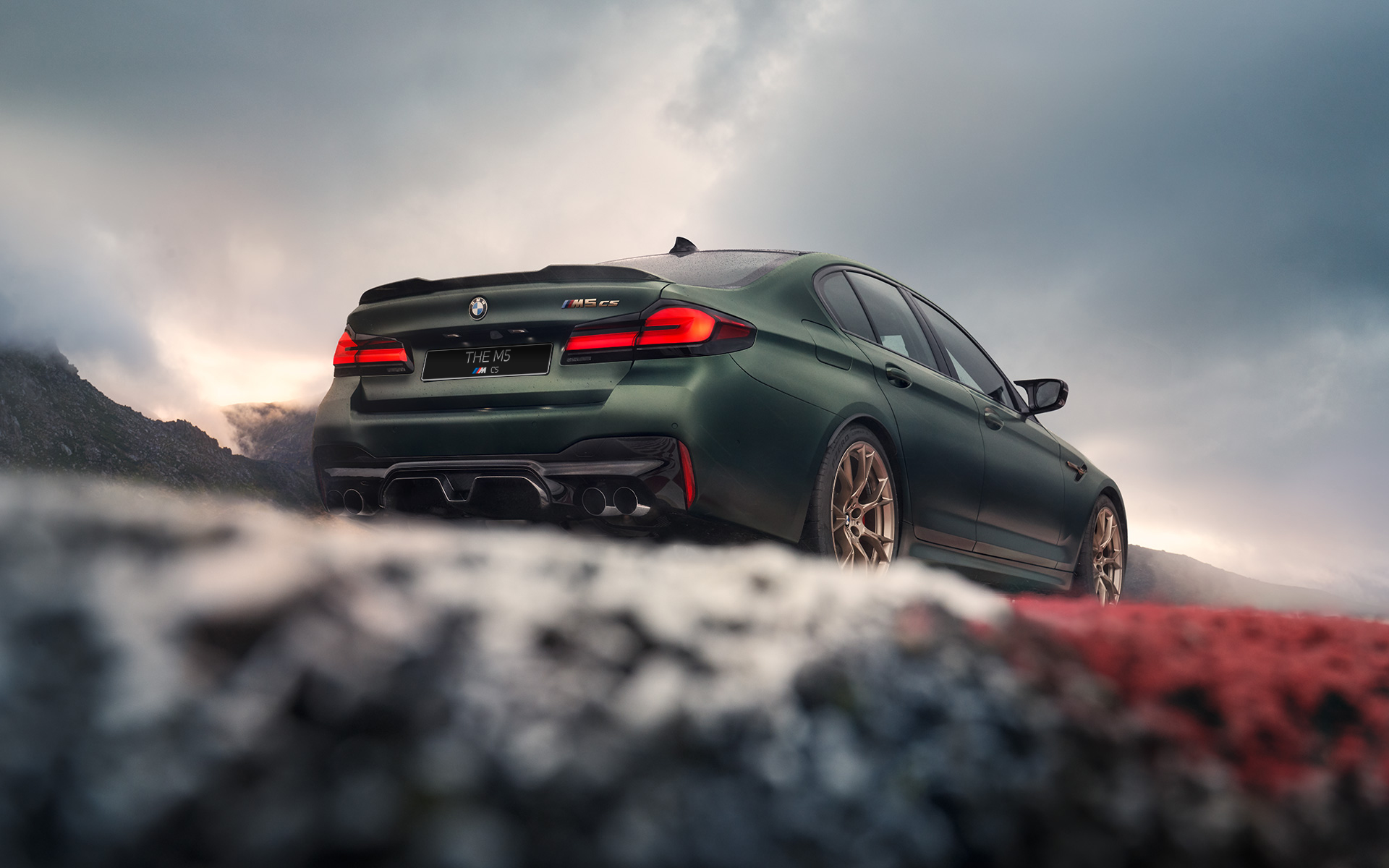 BMW M5 CS F90 2021 Frozen Deep Green metallic rear view low angle shot 